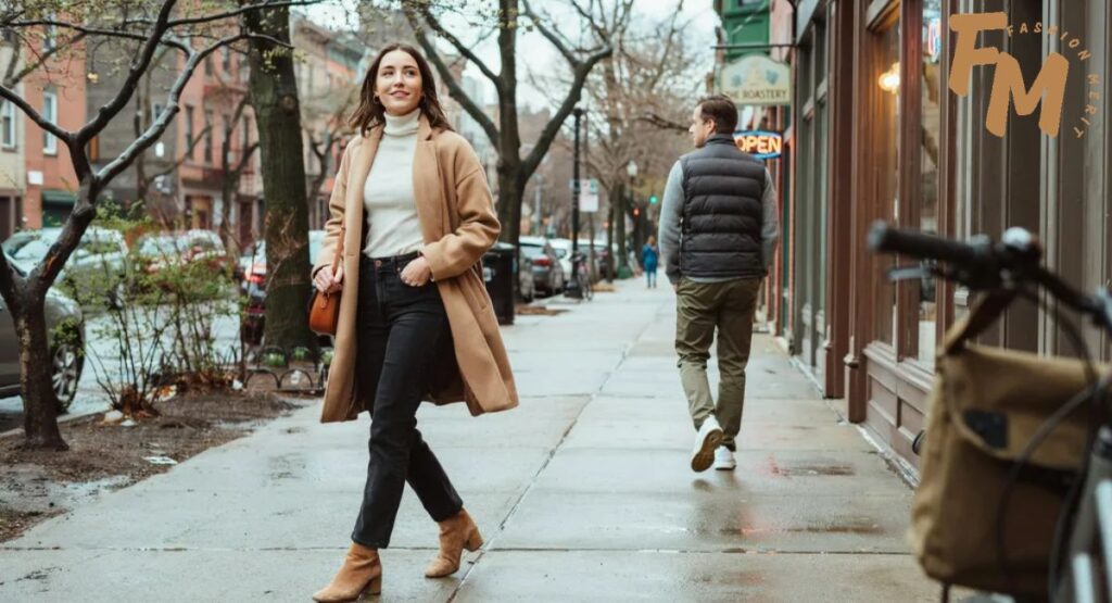 What to wear in 50 degree weather for women with a sweater dress and tall boots
